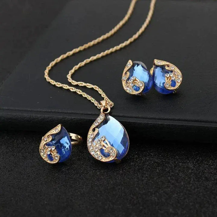 Set collana e orecchini in cristallo blu con finitura oro