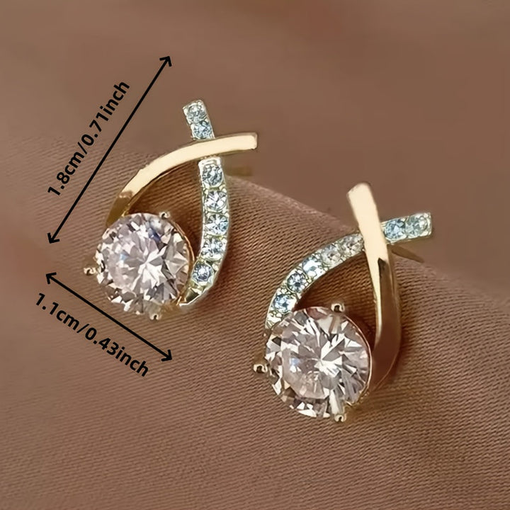 Orecchini a croce in zirconio color oro