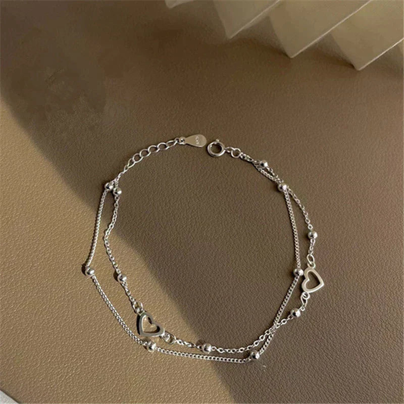 Braccialetto in argento regolabile con ciondolo a forma di cuore