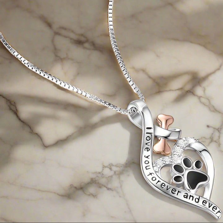 Collana portafortuna con ciondoli a cuore, osso e infinito
