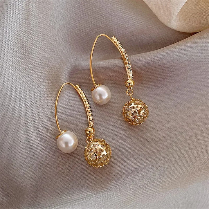 Gocce vintage in oro e perla – Orecchini