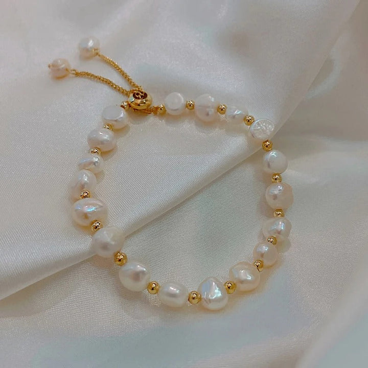 Braccialetto vintage con perla bianca e oro