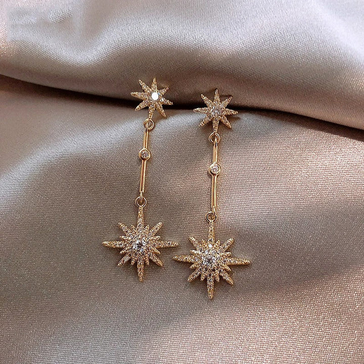 Orecchini vintage in oro con stella in cristallo